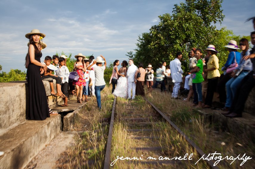 Surprising the bride and groom.  Somewhere in a Cambodian wedding album is a photo of our bamboo train full of Green Mango girls and two Americans waving as we passed the happy couple!
