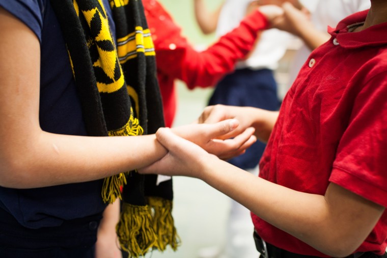 #16- Doing a lesson with my students about Helen Keller by having them blindfolded and trying to write words in each others hands.  Yes, I that's a steelers scarf used as a blindfold.
