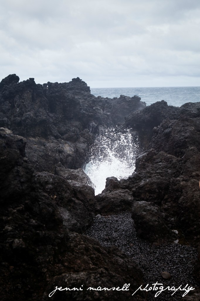 A blow hole in action at Wai'anapanapa Black Sand Beach 