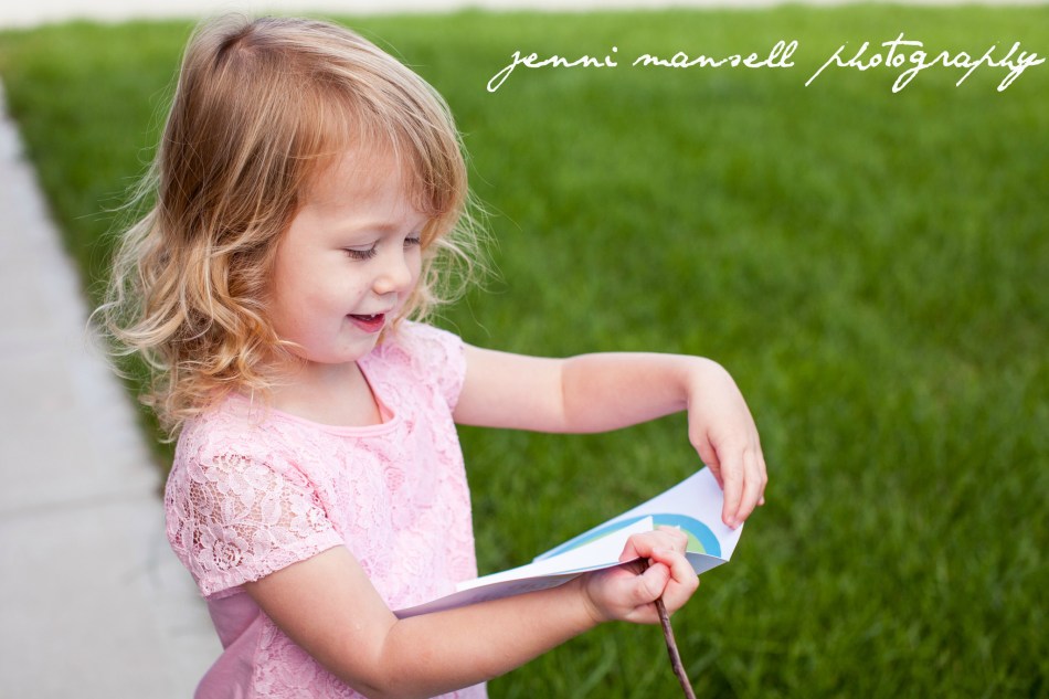Here is Addison opening a birthday card she got from the mailbox.  :)